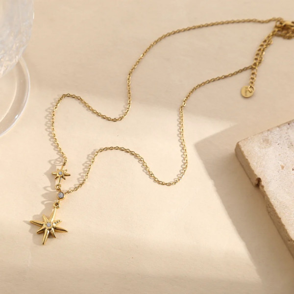 Collier doré chaîne fine pendentif étoile 8 branches strass central - 1