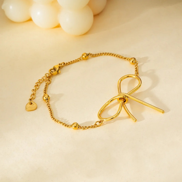 Bracelet Doré Chaîne Boules Dorées Avec Grand Nœud Papillon - 2