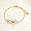 Bracelet chaîne dorée fine double fleur blanche - 1