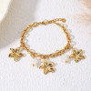 Bracelet chaîne dorée breloques fleurs et fleurs en perles - 1