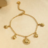 Bracelet chaîne fine dorée pendentifs soleil, étoiles et soleils