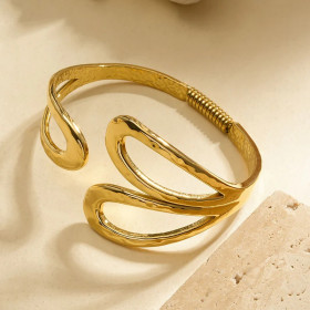 Bracelet jonc doré ouvert à motifs ajourés en forme de gouttes martelées - 1