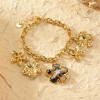 Bracelet Doré Chaîne avec Breloques Fleur en Résine Léopard