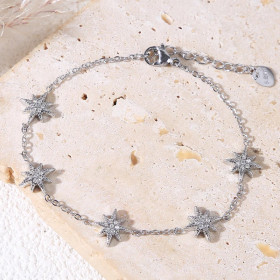 Bracelet argenté chaîne fine avec pampilles étoile 8 branches strassés - 1