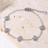 Bracelet argenté chaîne fine avec pampilles étoile 8 branches strassés - 1