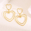 Boucles d'oreilles pendantes double cœur fins