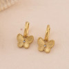 Boucles d'oreilles mini créoles dorées avec papillon serti d'un strass