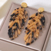 Boucles d'oreilles pendantes dorées feuilles articulées imprimé animalier