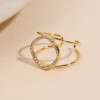 Bague dorée ajustable à double branche ajouré pavé de strass - 1