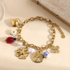 Bracelet chaîne pendentifs coccinelle fleurs et cœurs
