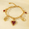 Bracelet chaîne dorée pendentifs cœurs ex-voto centre émail rouge