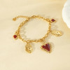 Bracelet chaîne dorée pendentifs cœurs ex-voto centre émail rouge - 2
