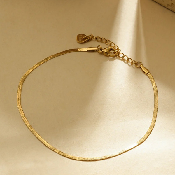 Chaîne de cheville dorée style maille plate serpent - 1